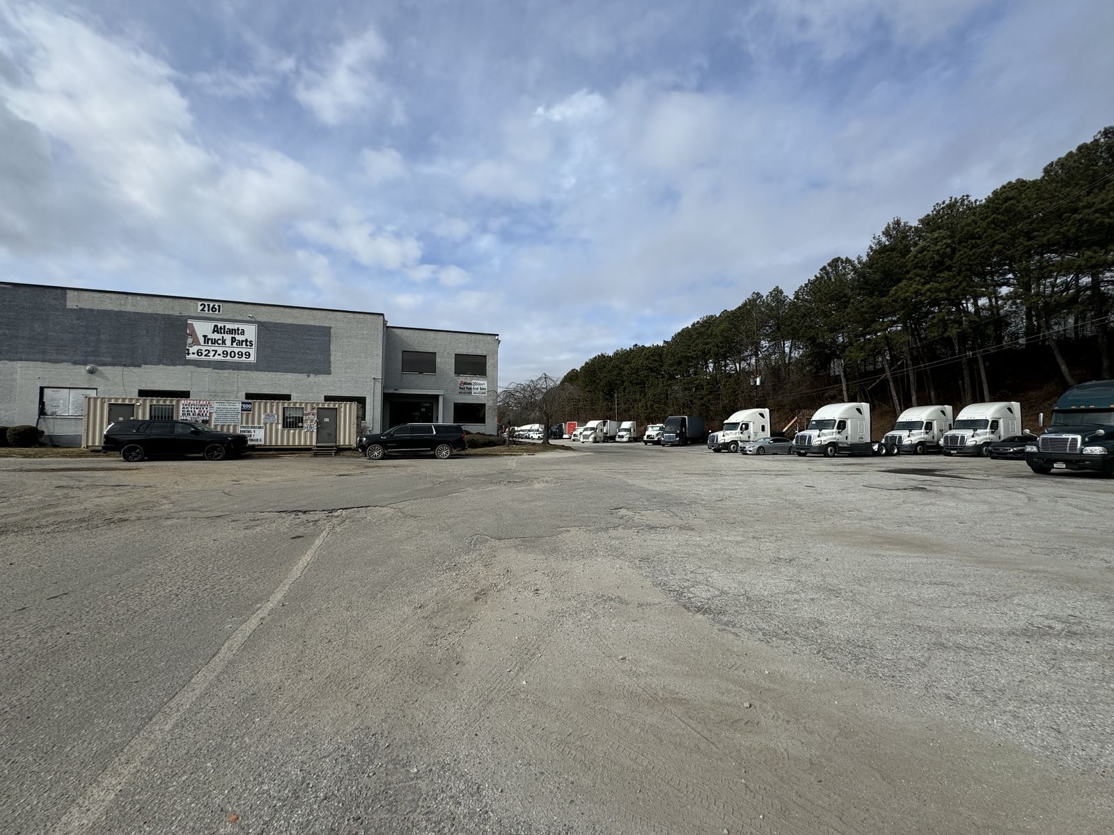 Gated entrance and guard booth at Moreland Ave truck parking
